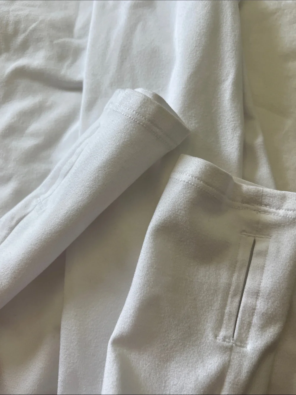 White full turtle neck top with thumb holes
